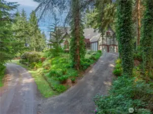 Welcome home! This gorgeous property shares a private road with just one other home. The gravel driveway was just regraded. About two-thirds of the 5 acres is forested with native trees and lush undergrowth, offering privacy and wildlife habitat.