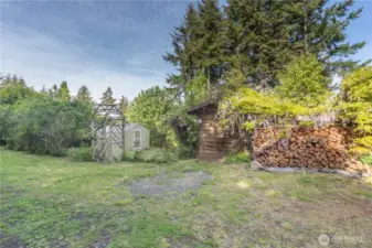 160 Bywater Way has a small fenced vegetable garden with a green house, a functional shed, and lots of wood ready for your new homes' fireplaces.