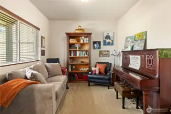 Versatile office/den with a large window!