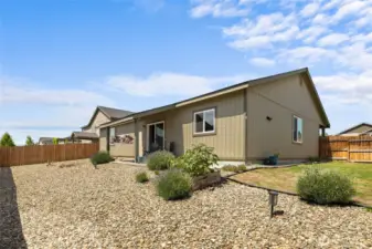 Nice grass yard area along the east side of the home.
