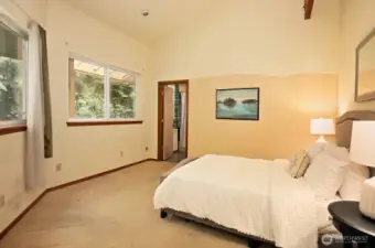 Primary bedroom with door to full bath