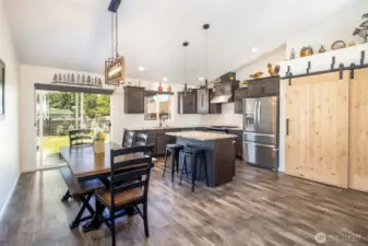 Open concept Living Dinning Kitchen with access tho the back patio