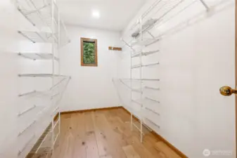 A generous walk-in closet offers abundant storage and organization options. With space for everything!