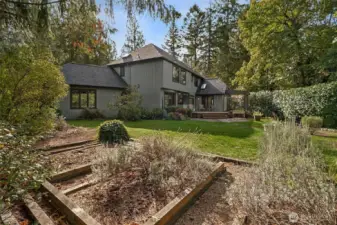 Set on over 1.3 acres of beautifully laid-out grounds, this property offers a perfect blend of function and charm. Multiple entertaining areas invite gatherings large or small, while thoughtfully planned garden spaces provide room to grow and create.