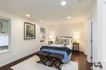 Primary suite offers a walk in closet and private bath.