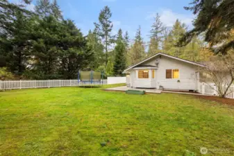 Level fenced backyard offers plenty of room to romp, and a new rear patio, ideal for entertaining.