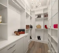 California Closet in primary bedroom with room for all your clothes