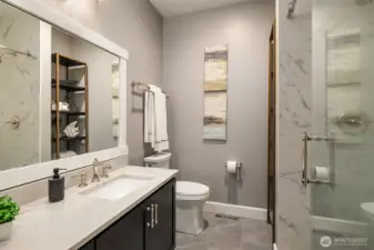 Completely remodeled hall 3/4 bath with custom vanity, lighting, tile floor and tile walk in shower