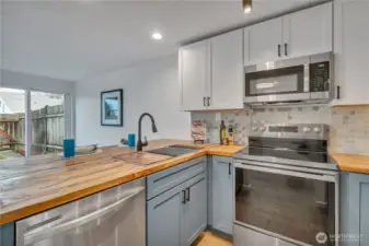 Gleaming new stainless steel appliances.