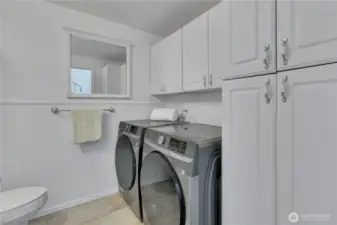 Laundry comes with plenty of storage.  Large W/D included with sale.