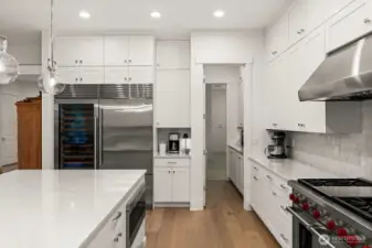 Through the doors to the pantry and small appliance station- then trough to the laundry room- SO good