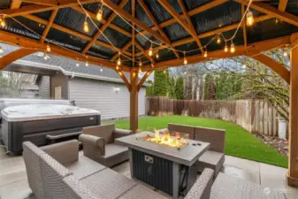 Fantastic entertaining back yard, features turf lawn, covered Gazebo with tiled flooring, propane fireplace and Hot Tub