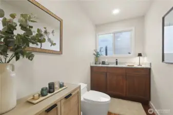 A modern half bath is a compact yet stylish space that makes a strong visual statement through clean lines, sleek materials, and smart design. Conveniently located on the main level off the kitchen/dining/livingroom area, perfect guests when entertaining.