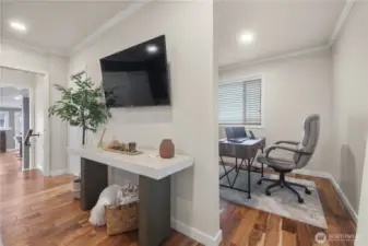 A small alcove just off the upper level bedroom is the perfect place for an office or a work out room.  Natural light from the window during the day and still being able to capture those water views.