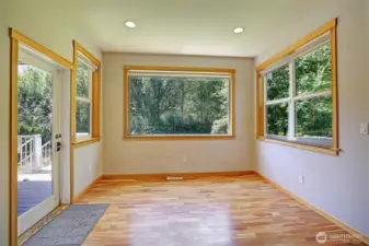 Dining area off kitchen with door to the heated back deck