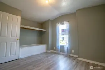 2nd bedroom w/ built-in bench.  Maybe a great space for a reading nook?