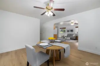Dining room connects to the living room and the kitchen.