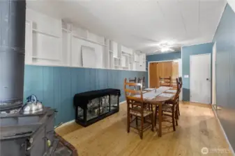 Look at all that built-in shelving and a woodburning stove!
