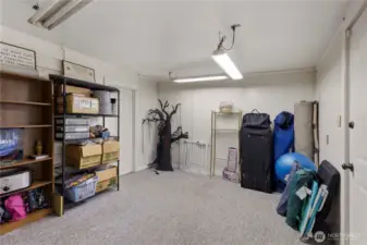 Large storage room accessible from backyard, garage and rec room.