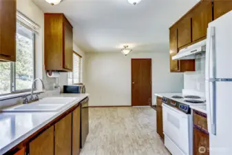 Left into the kitchen with breakfast nook and/or dining area