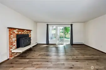 Working wood fireplace and sliding door access to the back yard