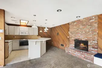 Pool house kitchen and fireplace.
