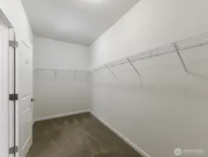 Primary Closet with wire racks plenty of space.