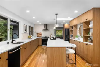 Fully remodeled kitchen featuring custom cabinetry, quartz countertops, and a spacious island designed for modern living.