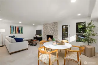 Spacious lower-level gathering area with refreshed fireplace, updated finishes, and room to relax, host, or unwind at the end of the day.