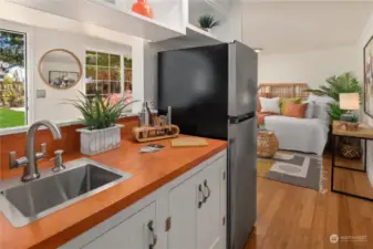 Here is a shot of the efficient kitchenette that is tucked off the main living room.