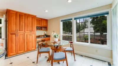 The eating nook is large enough to be a 2nd dining room for those large parties.  In addition to the large pantry the is a work desk area with a granite counter.  A sliding glass door takes you outside onto the fun spacious deck.