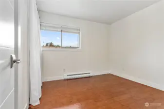 2nd bedroom on the other side of the bathroom and at the opposite end of the hall from the primary.