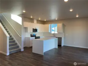 Living Room leading to upstairs