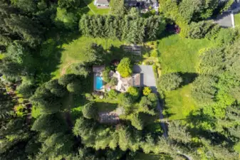 Highly desirable, beautiful estate on 4 flat, usable acres, fenced, gardens, orchard...so much to offer!