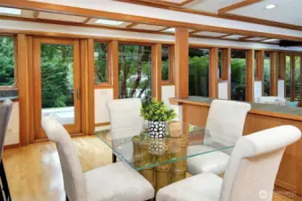 Light-filled informal eating area with glass door to deck for outdoor enjoyment.