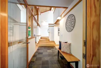 Stunning entry with fir beams and cedar ceilings.