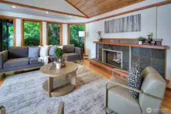 Living Room with fir windows, cedar ceiling, slate fireplace.