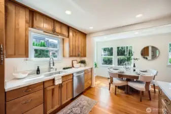 Take a look at the stunning quartz countertops, under cabinet lighting, and brand new sinks, faucets and stainless dishwasher!