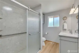 Newly remodeled bathroom with walk-in shower & pretty vanity & storage cabinets ~