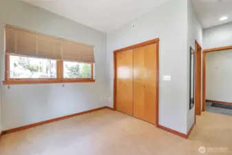 The 2nd bedroom is designed to offer comfort and privacy to guests, allowing them a dedicated place to rest and relax during their stay. Access to the 3/4 bath is just as you walk into the short hallway from the entry.