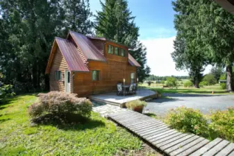 This cottage nestled in the trees is gorgeous and lives much bigger than it is. Come to one of the open houses to see for your self.