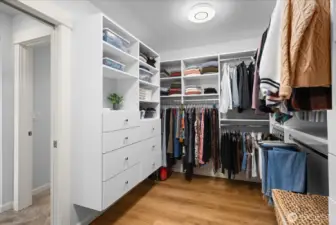 Primary Walk-in Closet with Closet System Organizer