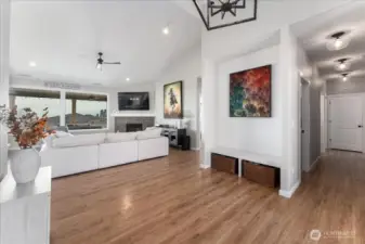 Entryway towards living room and hallway to bedrooms.
