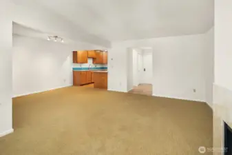 View from windows in living room to entry, kitchen and dining.