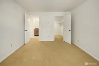 View from bedroom window looking at walk-in closet on right and bathroom across the hall.