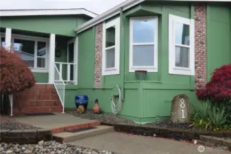 Sit out on the front porch (with electric shade) and enjoy the passerbyers as they walk their dogs or go get their mail.