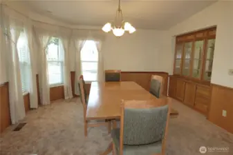 Large dining room with built ins looking out to the clubhouse.