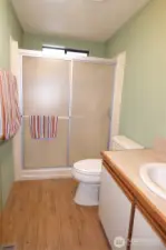 Main 3/4 bathroom with window above shower for ventilation.