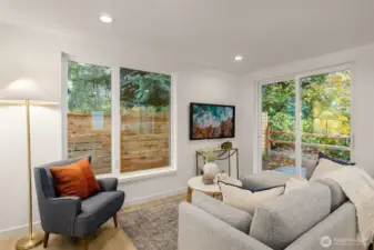 Large windows brighten the main living floor, making an enticing place to relax & entertain...