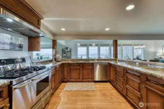 This is a one incredible kitchen, the large range hosts double ovens, look at all of those cabinets and counter space.